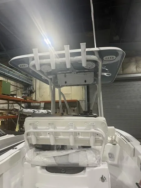 Slide: The Image of 2024 Sea Hunt Ultra 229 boat interior with T-top and rod holders. - 5