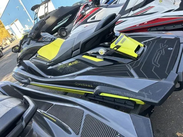 Slide: The Image of 2021 Yamaha Waverunner FX SVHO in black and yellow, parked outdoors. - 6