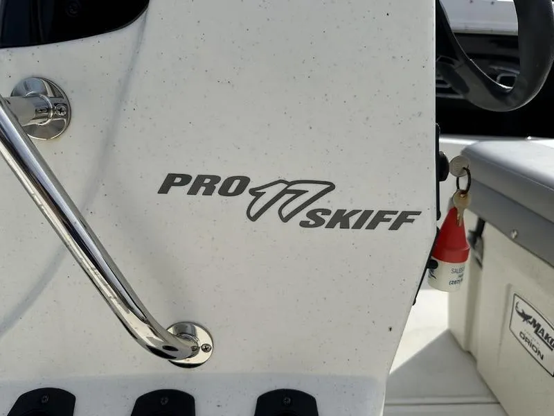 Slide: The Image of Close-up of 2023 Mako SKIFF 17 CC boat console with Pro Skiff logo. - 6