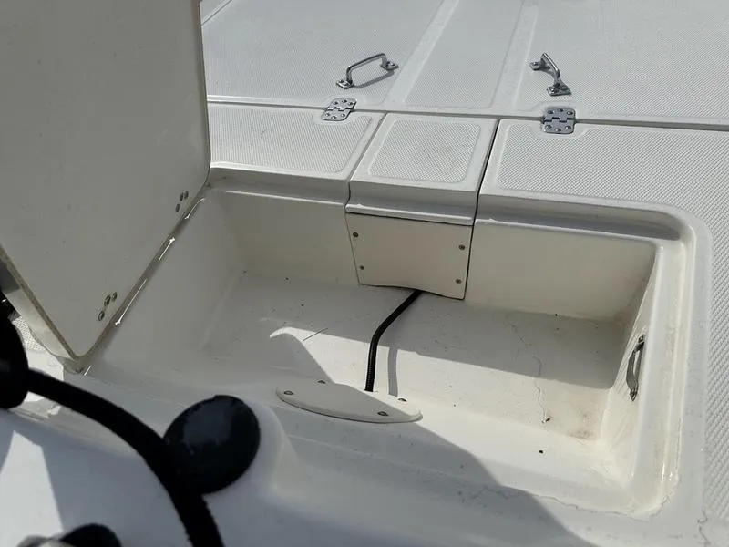 Slide: The Image of Open storage compartment on 2023 Mako SKIFF 17 CC boat. - 8