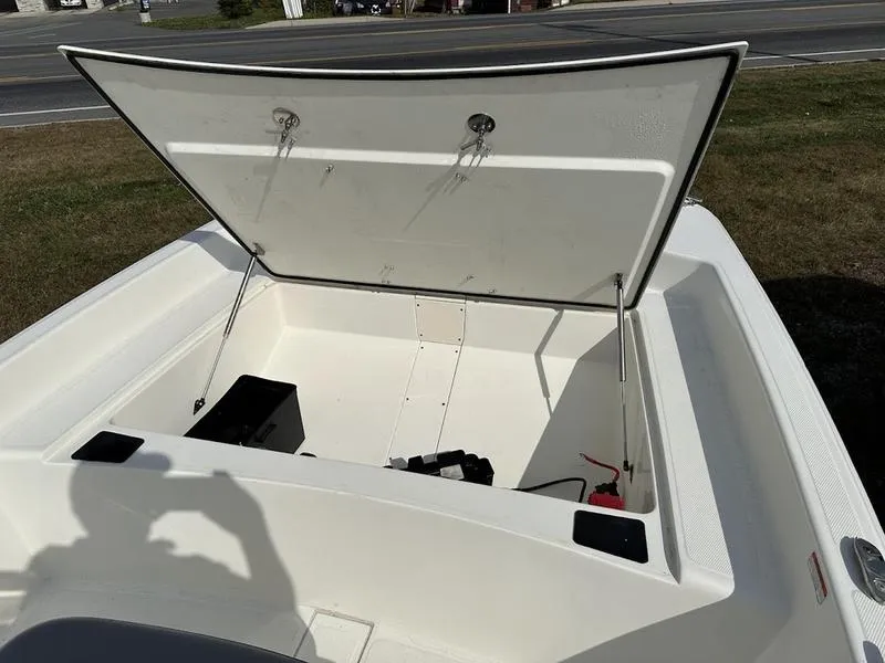 Slide: The Image of 2023 Mako SKIFF 17 CC boat with open storage compartment. - 9