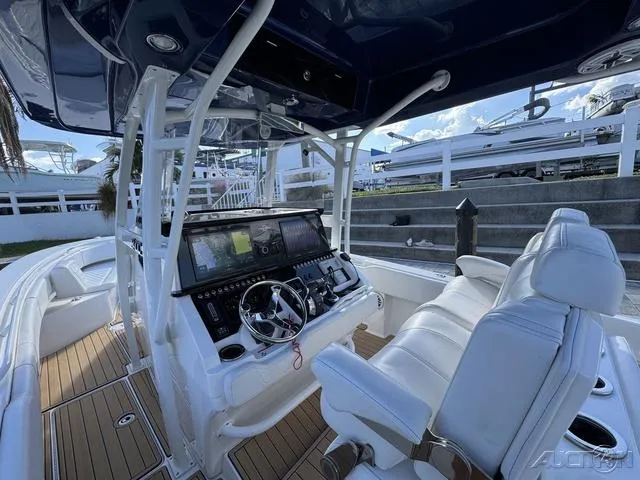 Slide: The Image of 2023 Fountain 34 CC boat interior with modern helm and seating. - 25
