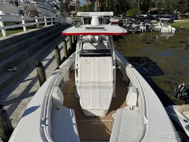 Slide: The Image of 2023 Fountain 34 CC boat with sleek design and spacious seating. - 32