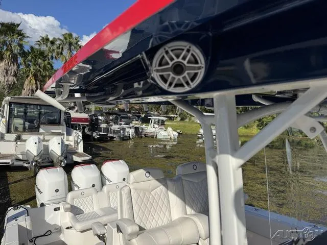 Slide: The Image of 2023 Fountain 34 CC boat with luxurious seating and powerful outboard engines. - 37