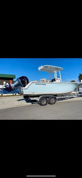 Slide: The Image of 2023 Sportsman 231 Heritage boat on trailer, parked outdoors. - 1