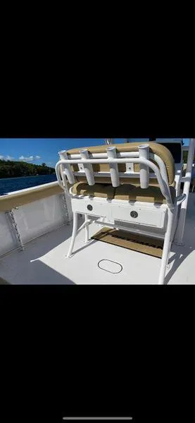 Slide: The Image of 2023 Sportsman 231 Heritage boat deck with seating and rod holders. - 11