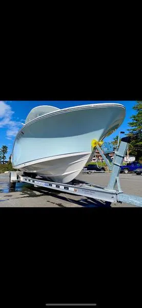 Slide: The Image of 2023 Sportsman 231 Heritage boat on trailer, parked outdoors. - 4