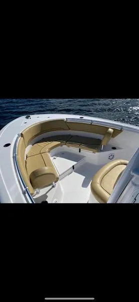 Slide: The Image of 2023 Sportsman 231 Heritage boat with tan seating on open water. - 5