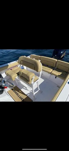 Slide: The Image of 2023 Sportsman 231 Heritage boat interior with tan seating on open water. - 7