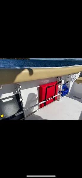 Slide: The Image of 2023 Sportsman 231 Heritage boat interior with safety equipment and ocean view. - 8