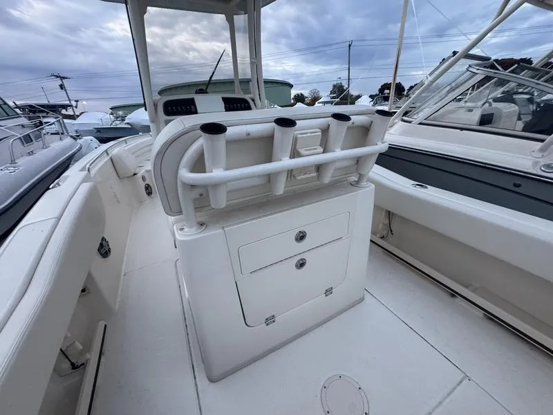 Slide: The Image of 2022 Grady-White 257 Fisherman boat interior with rod holders and storage compartments. - 15