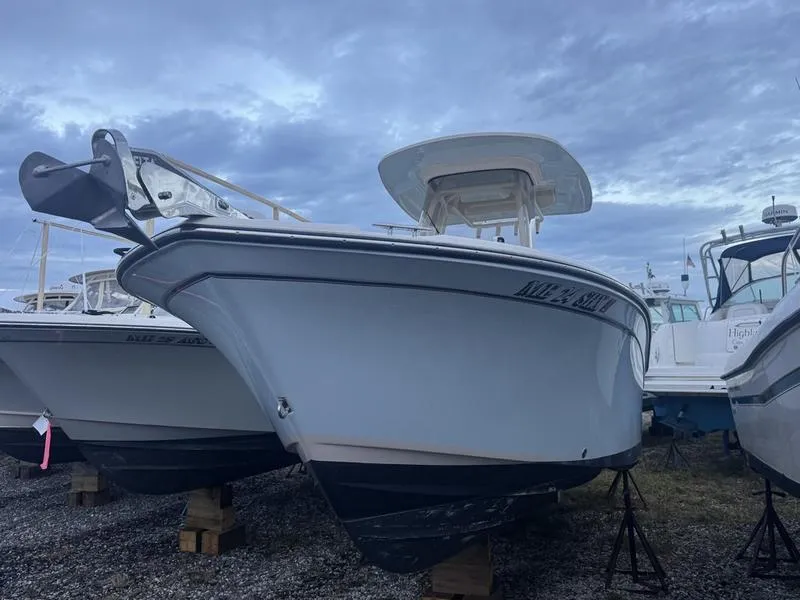 Slide: The Image of 2022 Grady-White 257 Fisherman boat on display under cloudy sky. - 6