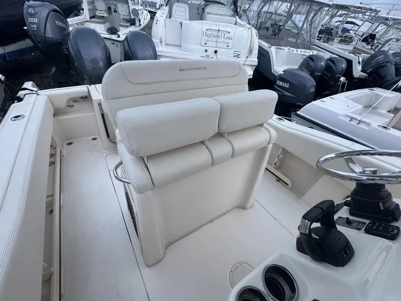 Slide: The Image of 2022 Grady-White 257 Fisherman boat interior with helm and seating area. - 7