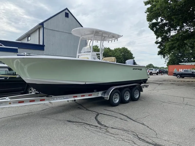 Slide: The Image of 2022 Sportsman 231 Heritage boat on trailer in parking lot. - 16