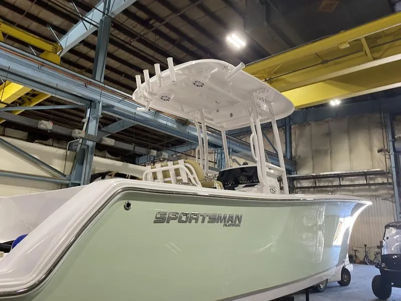 Slide: The Image of 2022 Sportsman 231 Heritage boat in warehouse, side view. - 5