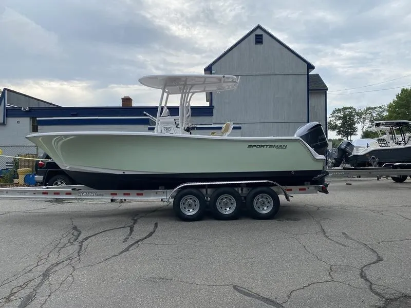 Slide: The Image of 2022 Sportsman 231 Heritage boat on trailer, parked outdoors. - 8