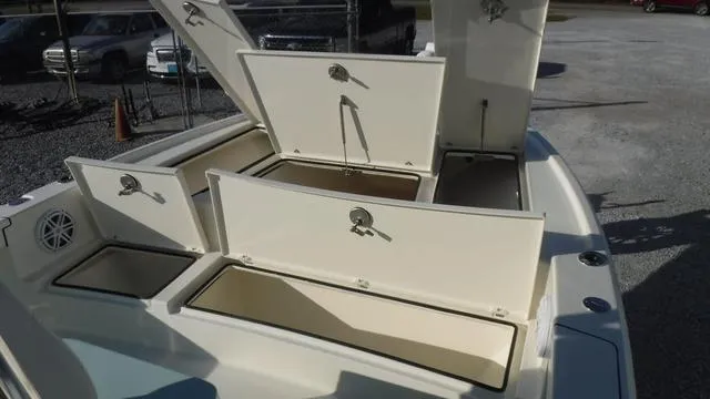 Slide: The Image of Open storage compartments on a 2025 Pathfinder 2500 Hybrid boat. - 10
