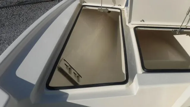 Slide: The Image of Open storage compartments on 2025 Pathfinder 2500 Hybrid boat. - 13