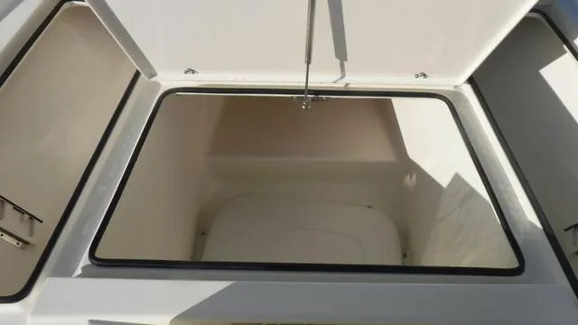 Slide: The Image of Open storage compartment in 2025 Pathfinder 2500 Hybrid boat. - 14