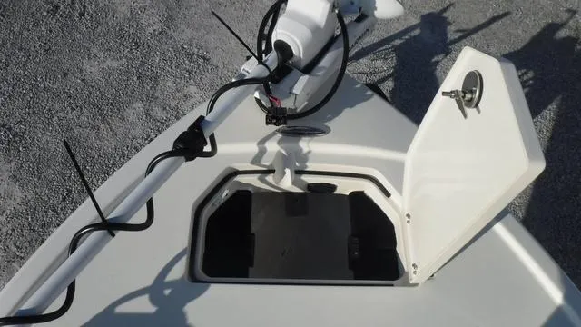 Slide: The Image of 2025 Pathfinder 2500 Hybrid boat with open storage compartment on deck. - 15