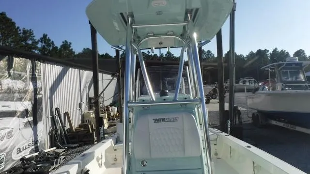 Slide: The Image of 2025 Pathfinder 2500 Hybrid boat with T-top in a marina setting. - 17