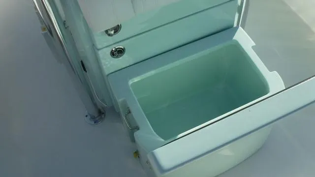 Slide: The Image of Pathfinder 2500 Hybrid 2025 boat storage compartment with open lid. - 20