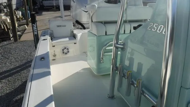 Slide: The Image of 2025 Pathfinder 2500 Hybrid boat interior with seating and storage. - 21
