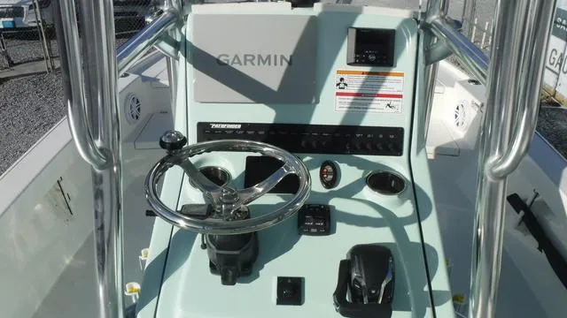 Slide: The Image of Pathfinder 2500 Hybrid 2025 boat console with Garmin navigation system. - 23