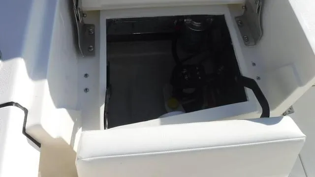 Slide: The Image of Open storage compartment on 2025 Pathfinder 2500 Hybrid boat. - 26