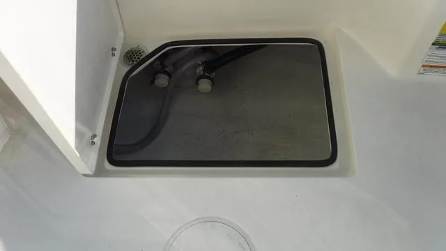 Slide: The Image of Pathfinder 2500 Hybrid 2025 boat storage compartment with closed hatch. - 28