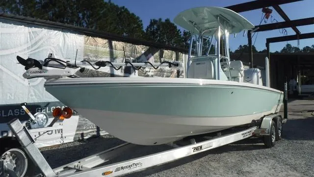 Slide: The Image of 2025 Pathfinder 2500 Hybrid boat on trailer, light blue hull, outdoor setting. - 3