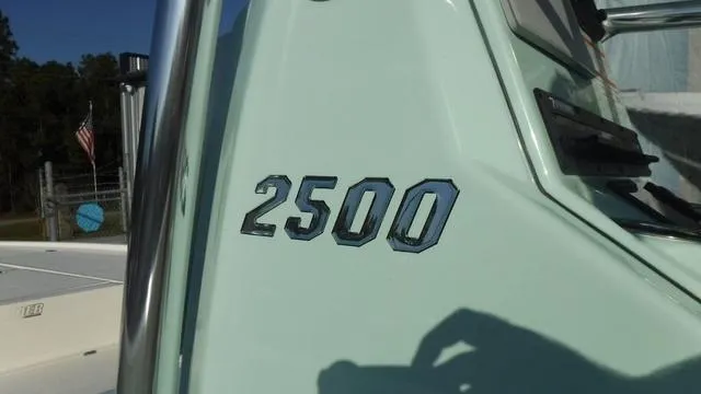 Slide: The Image of Pathfinder 2500 Hybrid 2025 boat model detail with chrome lettering. - 32