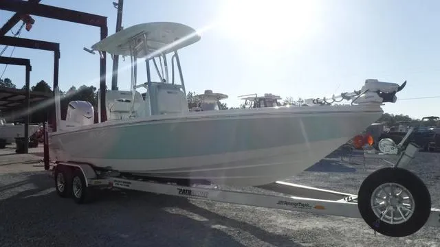 Slide: The Image of 2025 Pathfinder 2500 Hybrid boat on trailer in sunny outdoor setting. - 4