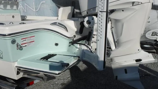 Slide: The Image of 2025 Pathfinder 2500 Hybrid boat stern with motor and swim platform. - 7
