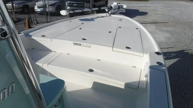 Slide: The Image of 2025 Pathfinder 2500 Hybrid boat deck in a parking area. - 9