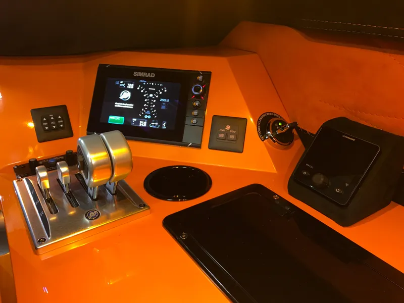 Slide: The Image of Dashboard of 2018 Daves Custom Boats M-44 with navigation controls and display. - 11