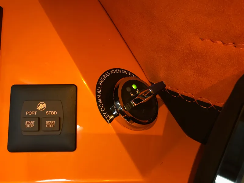 Slide: The Image of Dashboard controls of 2018 Daves Custom Boats M-44, featuring start/stop buttons and ignition switch. - 12