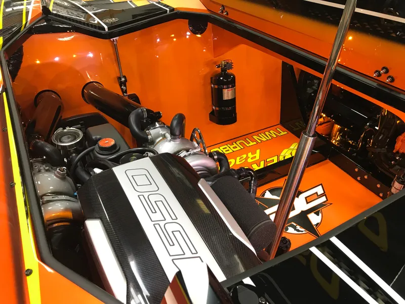 Slide: The Image of Engine compartment of 2018 Daves Custom Boats M-44, featuring vibrant orange detailing. - 15