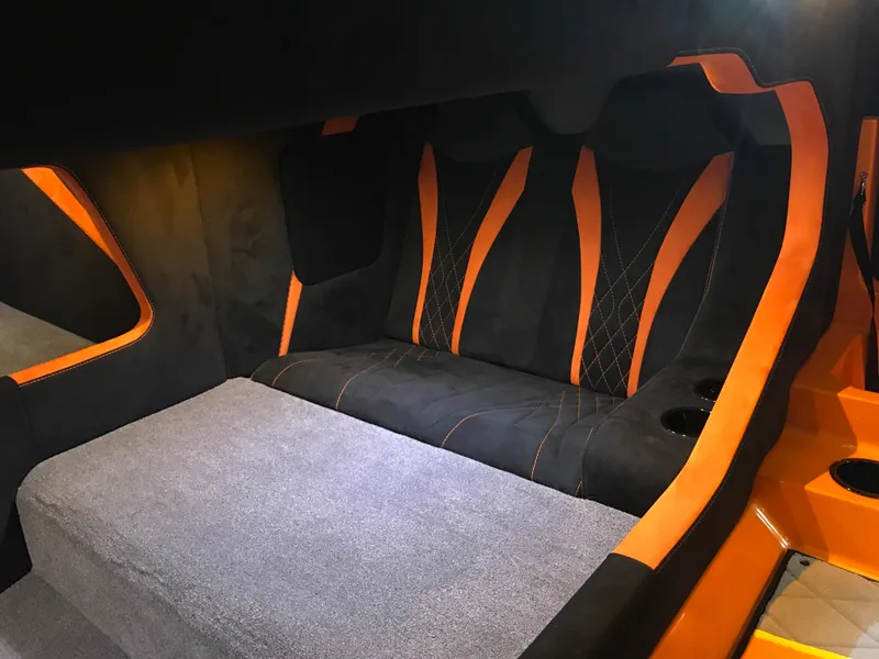 Slide: The Image of Interior of 2018 Daves Custom Boats M-44 with black and orange seating. - 18