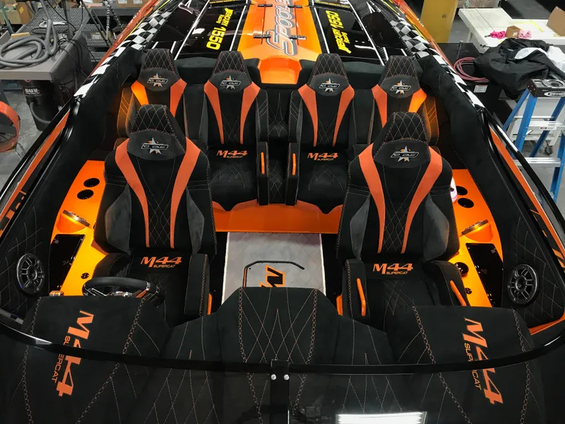 Slide: The Image of 2018 Daves Custom Boats M-44 interior with orange and black seating design. - 8