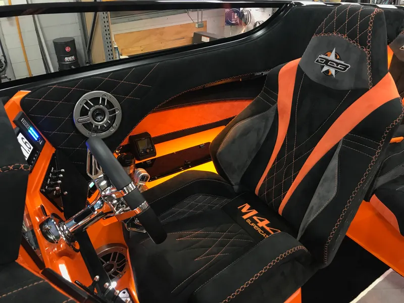 Slide: The Image of Interior of 2018 Daves Custom Boats M-44 with orange and black upholstery. - 9