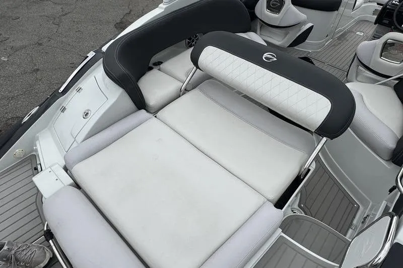 Slide: The Image of 2020 Crownline Eclipse E255 boat interior with cushioned seating and sleek design. - 10