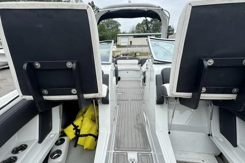 Slide: The Image of 2020 Crownline Eclipse E255 boat interior with seating and storage compartments. - 12
