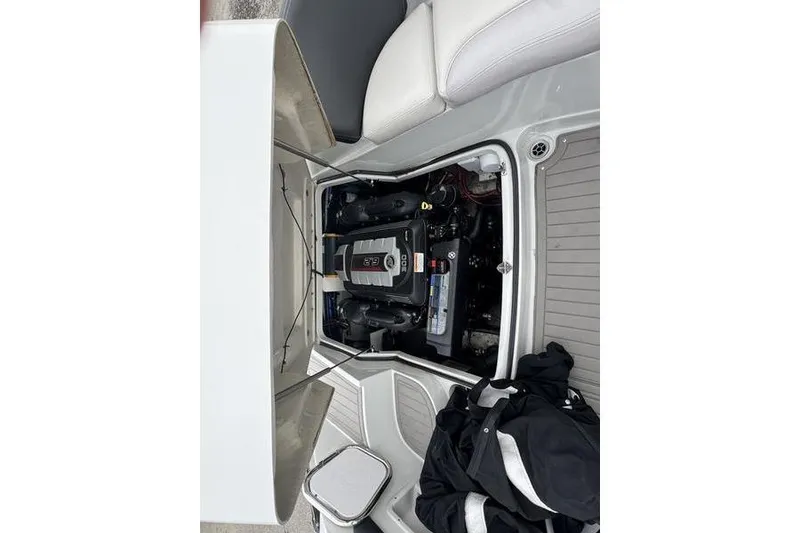 Slide: The Image of 2020 Crownline Eclipse E255 boat engine compartment with open hatch. - 14