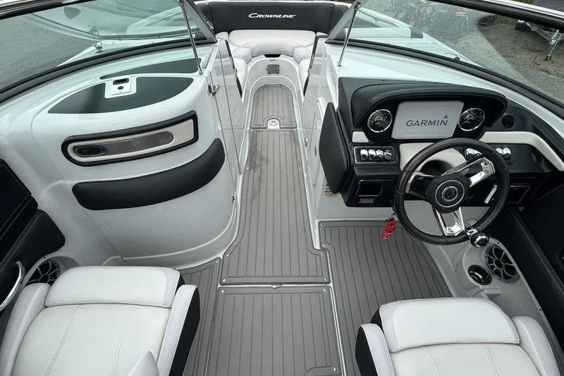 Slide: The Image of 2020 Crownline Eclipse E255 boat interior with Garmin navigation system and sleek seating. - 5