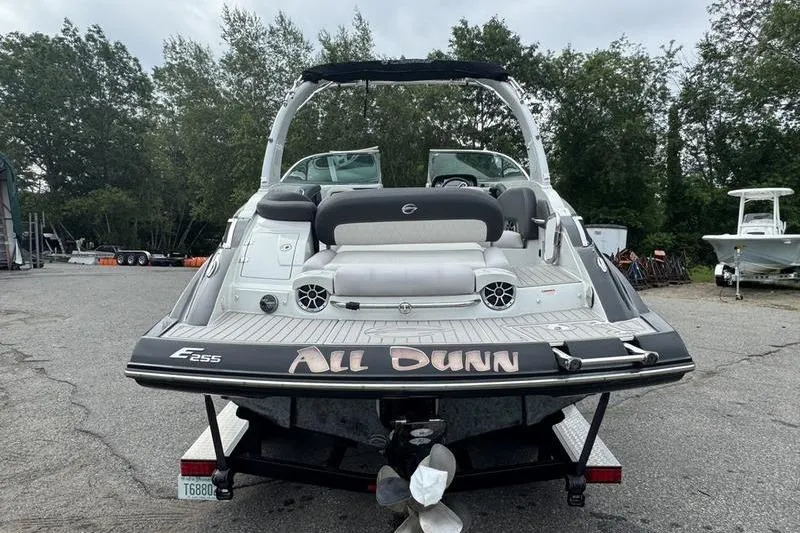 Slide: The Image of 2020 Crownline Eclipse E255 boat, rear view, parked outdoors. - 7
