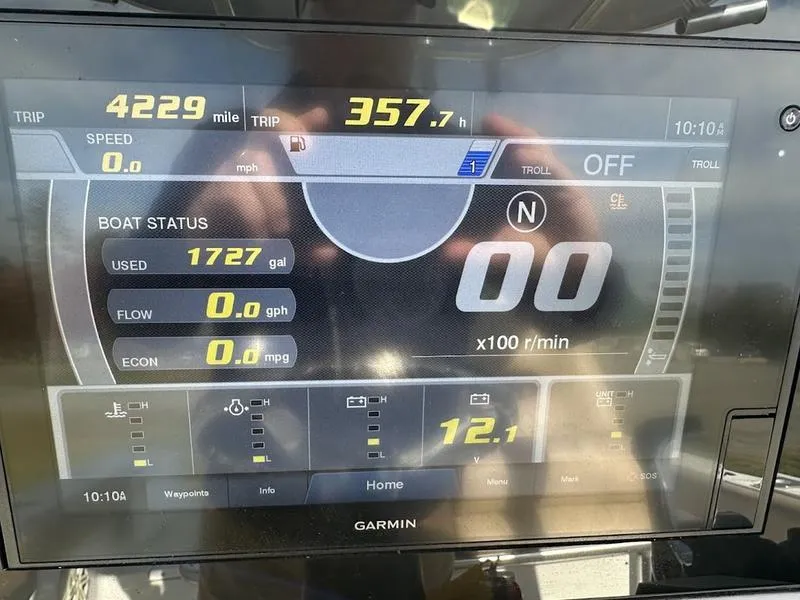 Slide: The Image of Garmin display on 2020 Sportsman 241 Heritage showing trip data and boat status. - 10