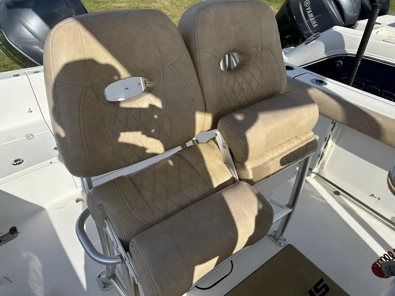 Slide: The Image of 2020 Sportsman 241 Heritage boat seats with tan upholstery and stainless steel frame. - 11