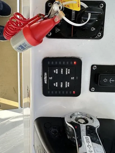 Slide: The Image of 2020 Sportsman 241 Heritage boat control panel with Yamaha key and safety switch. - 12