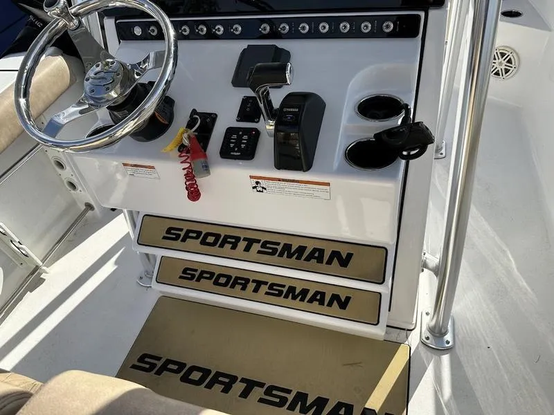 Slide: The Image of 2020 Sportsman 241 Heritage boat console with steering wheel and controls. - 13